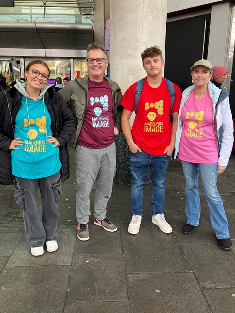 Made in His Image team members in colorful t-shirts